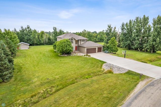 view of front of home featuring a front yard and a garage