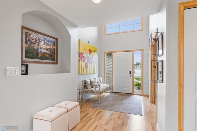 foyer entrance with light hardwood / wood-style floors