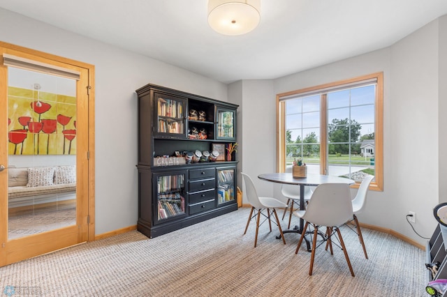 view of carpeted dining area