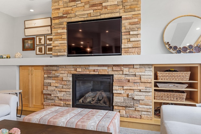 living room with hardwood / wood-style flooring and a fireplace