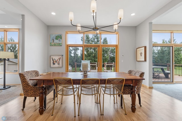 dining room with a chandelier and light hardwood / wood-style flooring