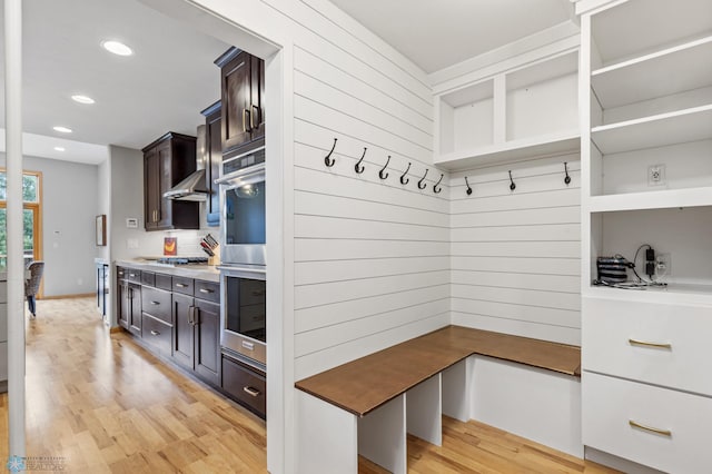 mudroom with light hardwood / wood-style flooring