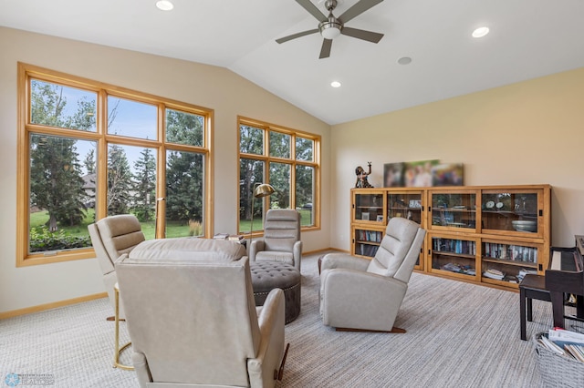 living room with vaulted ceiling, light colored carpet, and ceiling fan