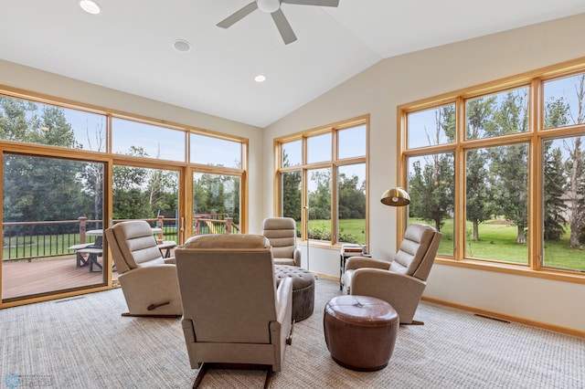 sunroom / solarium with vaulted ceiling, ceiling fan, and plenty of natural light