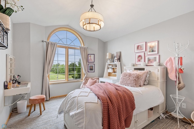 carpeted bedroom with lofted ceiling and multiple windows