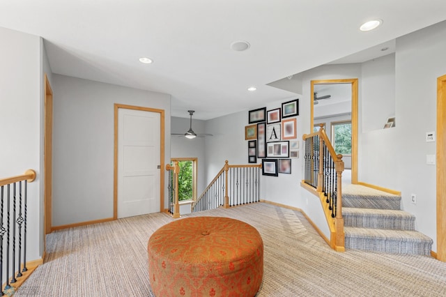 interior space with light carpet and plenty of natural light