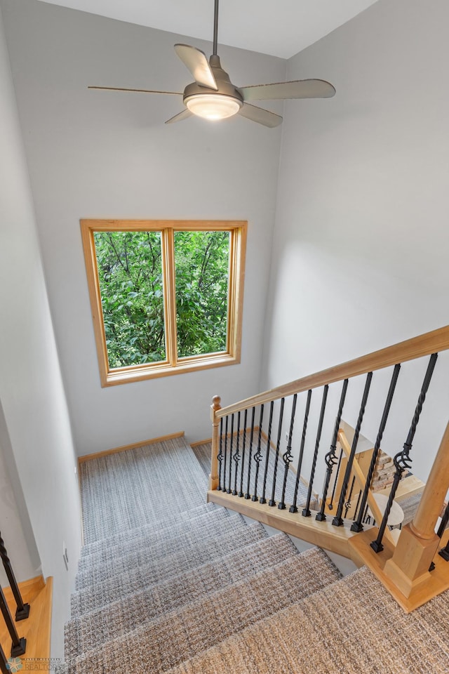 staircase with ceiling fan