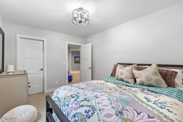 bedroom featuring light carpet