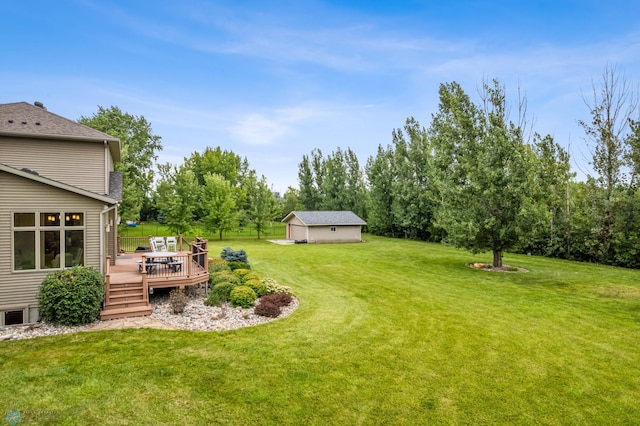 view of yard with a wooden deck