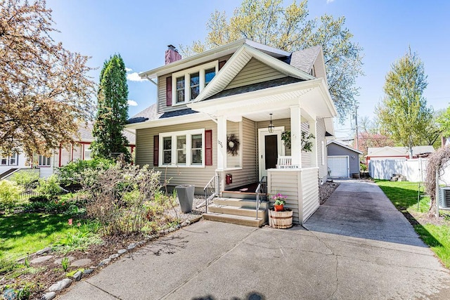 view of front of property with a front yard and covered porch