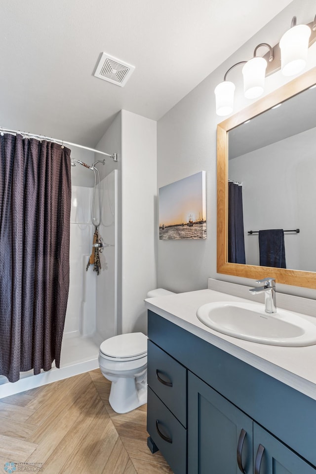 bathroom featuring vanity, a shower with curtain, hardwood / wood-style floors, and toilet