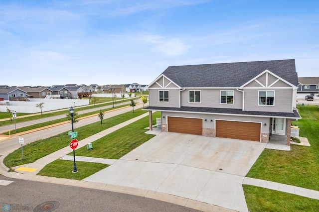 view of front of property with a garage and a front lawn