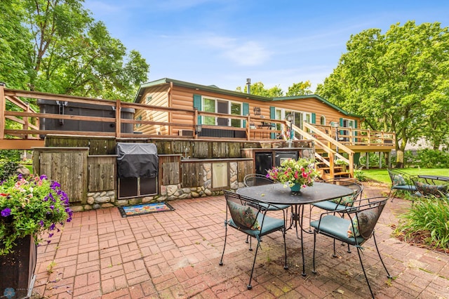 view of patio featuring a wooden deck and area for grilling