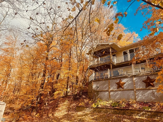 back of property featuring a deck