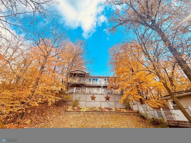 rear view of property featuring a balcony