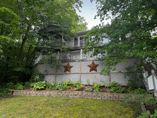 view of property exterior with a lawn