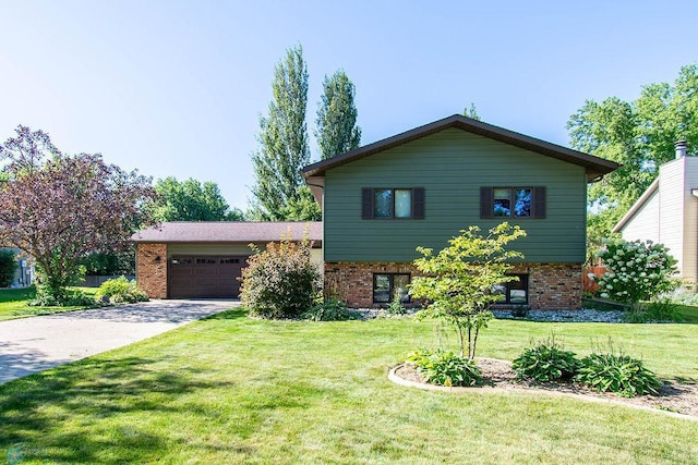 split level home with a garage and a front yard