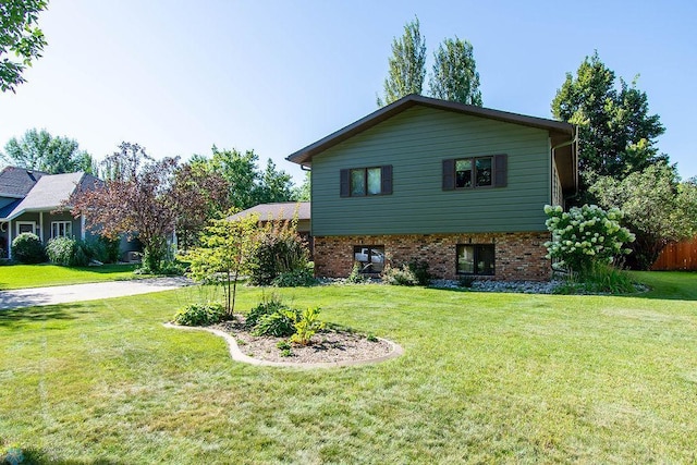 view of property exterior with a lawn