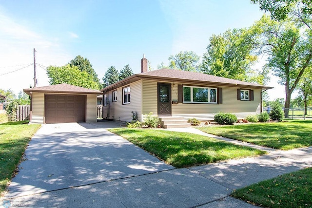 ranch-style home featuring a front lawn and a garage