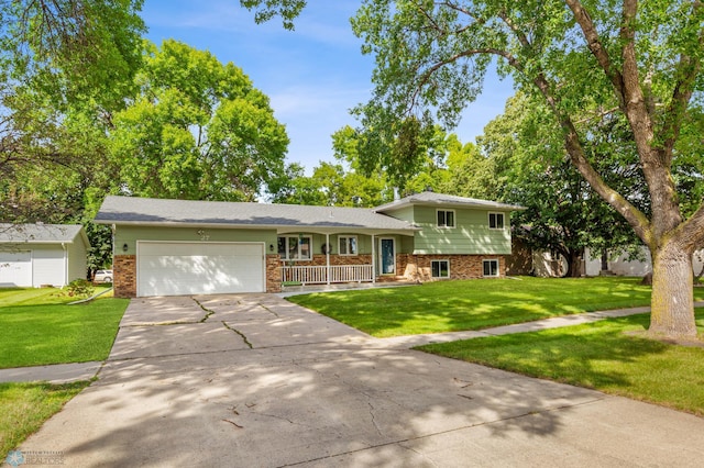 split level home featuring a garage and a front yard