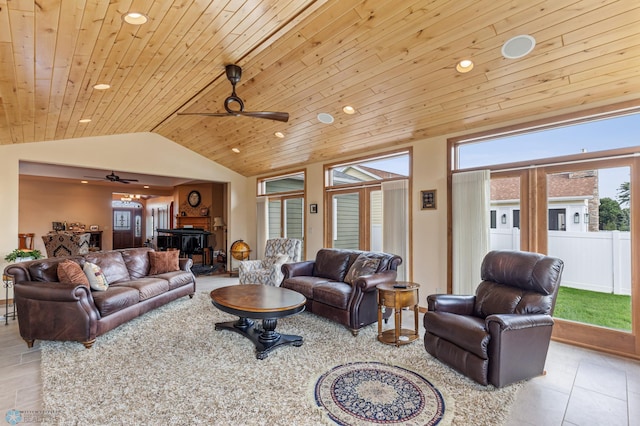 living room with ceiling fan, light tile patterned floors, wooden ceiling, and vaulted ceiling