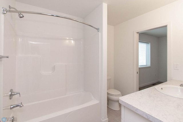 full bathroom featuring vanity, toilet, tile patterned floors, and bathing tub / shower combination