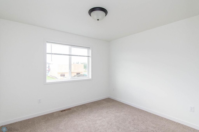 unfurnished room featuring carpet floors