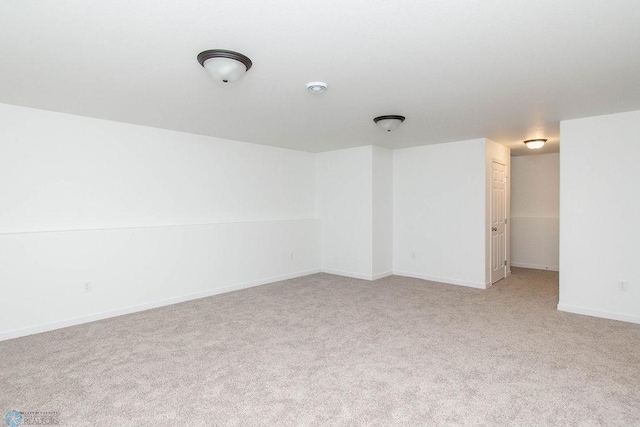 unfurnished room with light carpet