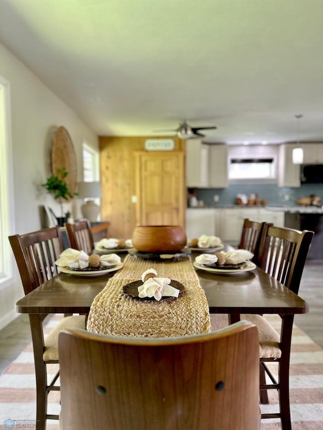 dining room featuring ceiling fan and light hardwood / wood-style flooring