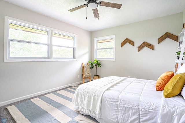 bedroom featuring ceiling fan and carpet flooring