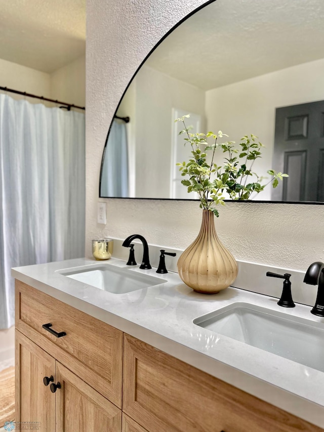 bathroom with vanity and a shower with curtain