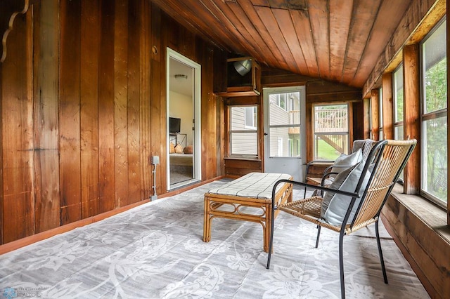 sunroom featuring vaulted ceiling and wooden ceiling