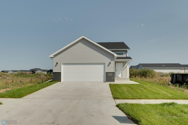 view of front of property featuring a front lawn and a garage