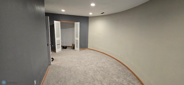 spare room with light carpet