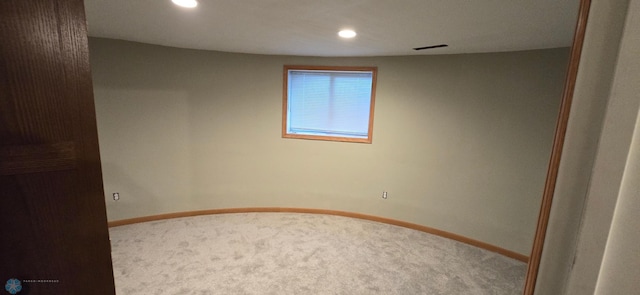 unfurnished room featuring carpet