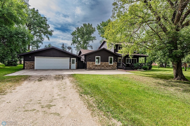 view of front of home with a front lawn and a garage