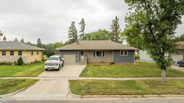 ranch-style house featuring a front yard and a garage