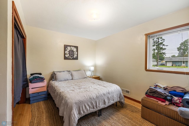 bedroom featuring wood-type flooring