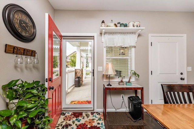 doorway to outside with wood-type flooring