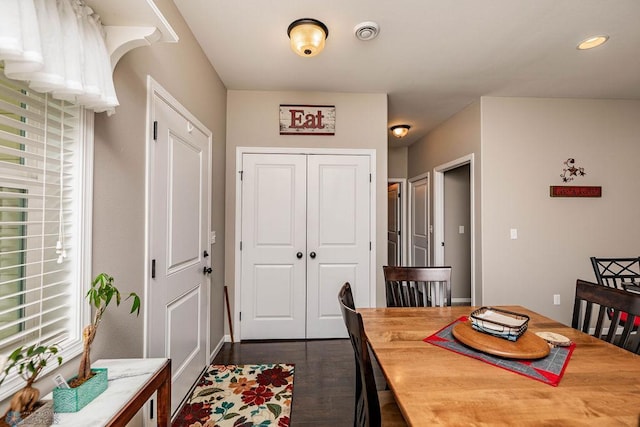 dining room with dark hardwood / wood-style floors