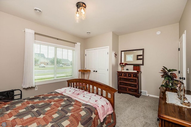 carpeted bedroom with a closet