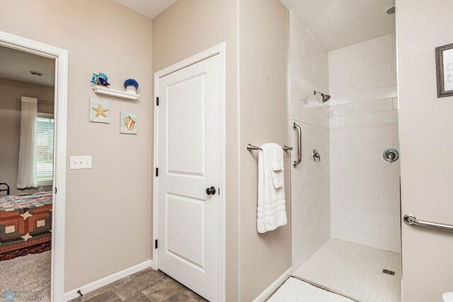 bathroom with tiled shower