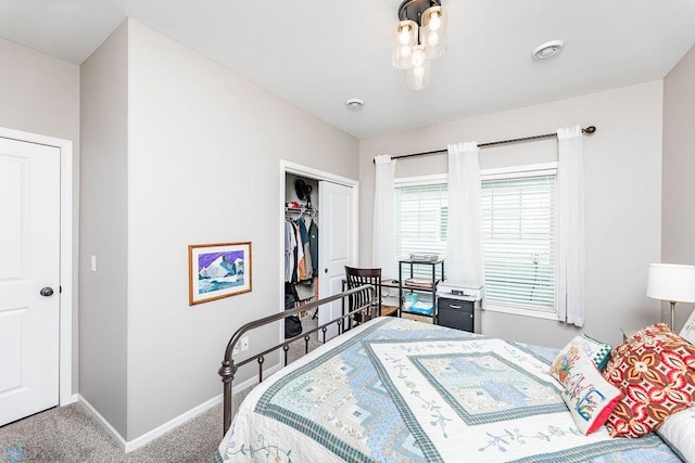 carpeted bedroom featuring a closet