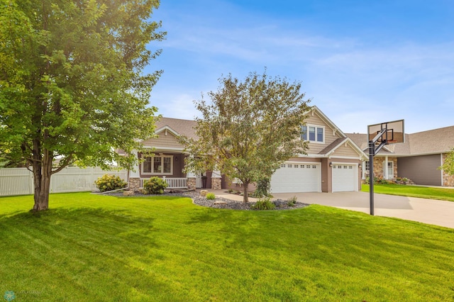 craftsman house with a front yard and a garage