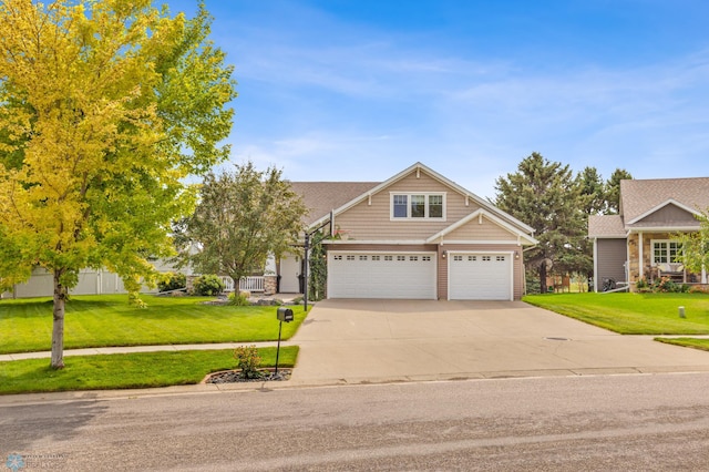 craftsman-style house with a garage and a front lawn