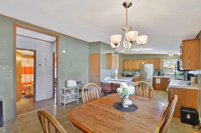 dining room featuring lofted ceiling, tile patterned flooring, a notable chandelier, and a textured ceiling