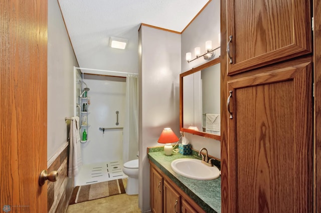 bathroom featuring vanity, toilet, curtained shower, and a textured ceiling