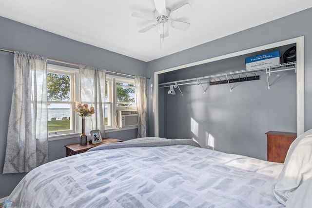 bedroom featuring cooling unit, ceiling fan, and a closet