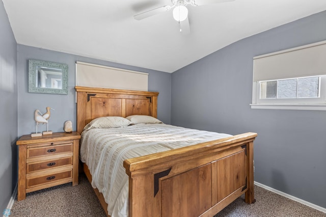 bedroom featuring lofted ceiling, ceiling fan, and carpet