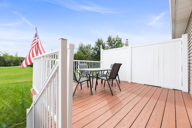 deck featuring a lawn